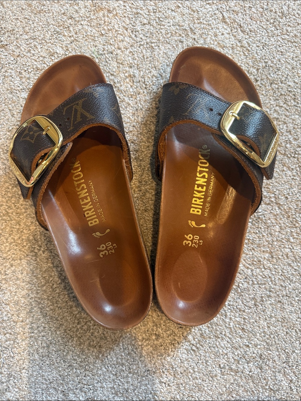 Authentic Birkenstocks customized with genuine Louis Vuitton leather